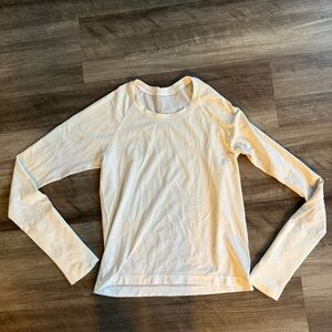 Swiftly Tech Long-Sleeve Shirt 2.0
Waist Length